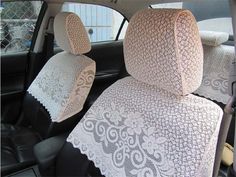 the interior of a car with white lace on it