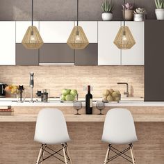 two white chairs sitting in front of a kitchen counter