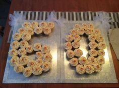 two cupcakes are arranged in the shape of the number 50 on a table