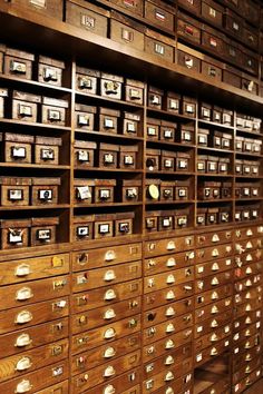 an old wooden filing cabinet filled with lots of drawers