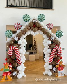 an arch made out of balloons and candy canes