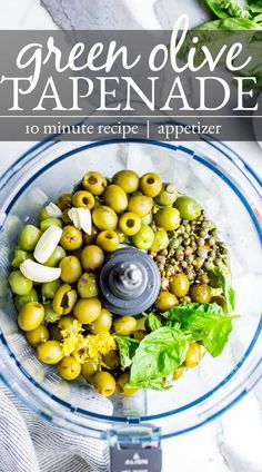 Olive tapenade ingredients in the work bowl of a food processor.