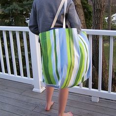 a person standing on a porch with a bag