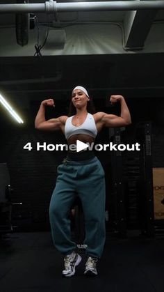 a woman flexing her muscles while standing in the middle of a gym area with text that reads 4 home workout