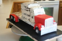 a cake made to look like a semi truck with white and red frosting on it