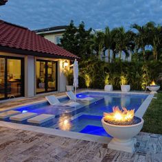 a fire pit sitting in the middle of a swimming pool