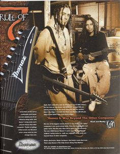 an advertisement for a guitar company featuring two men with dreadlocks on their heads