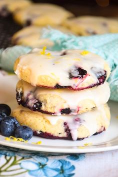 three blueberry shortcakes stacked on top of each other