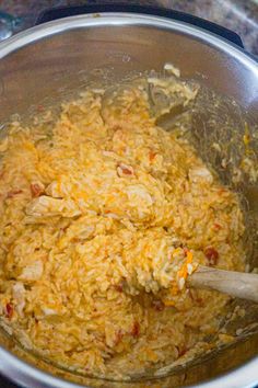 the food is being cooked in the pot on the stove