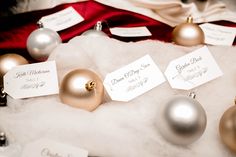 christmas ornaments and place cards are on display