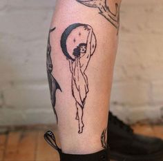 a person with a tattoo on their leg