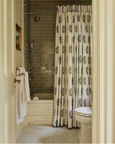 a bathroom with a shower, toilet and bathtub in it's doorway way