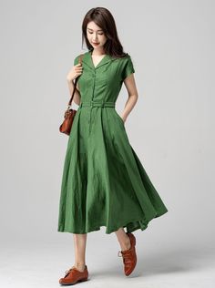 "This vintage-inspired short-sleeved shirt dress is the perfect addition to any retro lover's wardrobe! Featuring a classic collared neckline, front button closure, and a flattering A-line silhouette, this dress is both timeless and trendy. The lovely shade of green is sure to turn heads and the lightweight fabric makes it perfect for warmer weather. DETAILS * 50% linen, 50% cotton * Two side pockets * Front Button up closure * Belted dress * Short sleeve * Notched collar * Below knee Length * P A-line Dress Casual, Long Sleeve A Line Dress, Dresses With Buttons, A Line Shirt Dress, Dresses With Pockets Casual, Vintage Style Mid-length Midi Dress For Summer, Vintage Mid-length Midi Dress For Summer, Summer Vintage Dress For Work With Buttons, Vintage Style Mid-length Summer Midi Dress