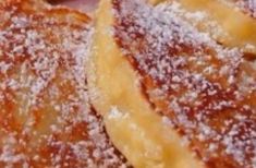 some type of pastry with powdered sugar on top