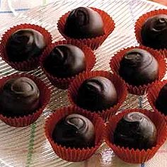 chocolates in red wrappers sitting on a plate