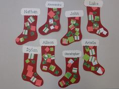 a group of christmas stockings with names on them