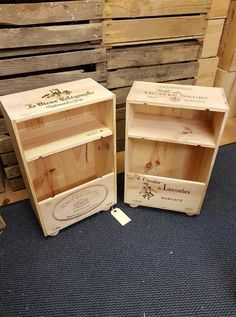 two wooden boxes sitting next to each other on top of a blue carpeted floor