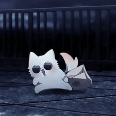 a paper cut out of a cat with sunglasses on