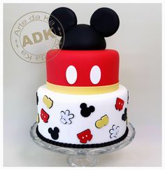 a mickey mouse cake on a clear plate