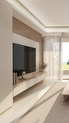 an empty living room with a large flat screen tv on the wall and white furniture