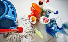 several different types of cleaning supplies on the floor