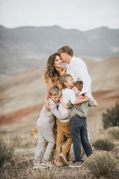 a family hugging each other in the desert