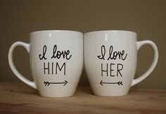 two coffee mugs with the words i love him and i love her written on them