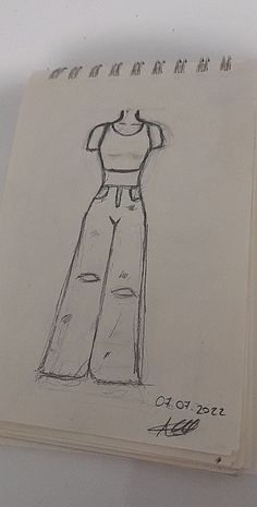 a drawing of a dress is shown on a piece of paper