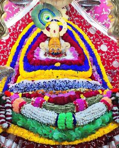 an elaborately decorated statue in the center of a room