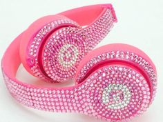 the headphones are covered in pink crystals