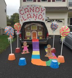 the back of a truck decorated with candy land and gingerbread man, girl, and boy