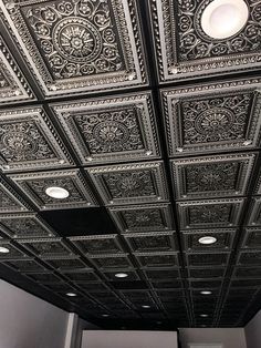 the ceiling is decorated with black and white tint, which has intricate designs on it