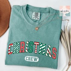 Christmas Crew 2024 Comfort Colors Shirt, Christmas Crew Tshirt, Christmas Party Shirt, Family Matching Christmas Shirt 2024, Holiday Shirts, Christmas Gift ❤ Comfort Colors® Brand Shirts & Unisex Adult Sizing The softly washed, garment-dyed fabric adds extra comfort to your wardrobe, and its relaxed fit makes it a great everyday choice. The shirt's double-needle stitching enhances its durability, and the absence of side seams helps it maintain its tubular shape. ❤ Please note that the rolled sleeves in our photos are for styling inspiration only, and any props shown are not included with your purchase. ❤ PRINT Our shirts are printed using Direct-To-Garment technology, ensuring durability without the risk of cracking or peeling. The ink becomes part of the fabric, providing a seamless and Christmas Party Shirt, Family Matching Christmas, Matching Christmas Shirts, Christmas Party Shirts, Styling Inspiration, Brand Shirts, Rolled Sleeves, Holiday Shirts, Branded Shirts