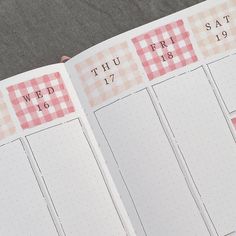 an open planner with pink and white checkered paper