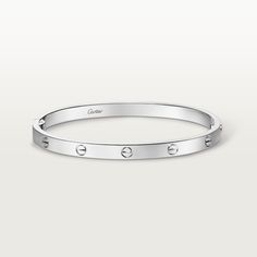 Cartier - LOVE bracelet, medium model - Bracelet Woman  - LOVE bracelet, medium model, 18K white gold (750/1000), closure system with functional screw and hinge. Comes with a screwdriver. Width 4.8mm. Created in New York in 1969, the LOVE bracelet is a jewelry design icon: a close fitting, oval bracelet composed of two rigid arcs, which is worn on the wrist and removed using a special screwdriver. Cartier continues the story of the original LOVE bracelet with a version featuring a hinge and an intermediate width, between the small and classic models. Same design, same story: a timeless – yet slightly slimmer – creation which is fastened using a screwdriver. On this model, the closing system consists of a functional screw on one side of the bracelet and a hinge on the other, enabling it to Oval Bracelet, Trinity Bracelet, Trinity Necklace, Cartier Earrings, Cartier Necklace, Trinity Ring, Design Icon, Love Bracelet, Bracelet Collection