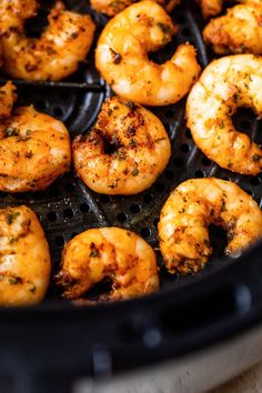 cooked shrimp being cooked in an air fryer