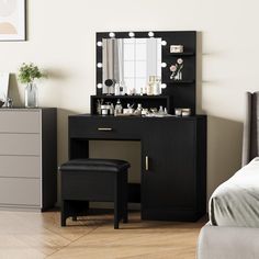 a bedroom with a vanity, stool and mirror