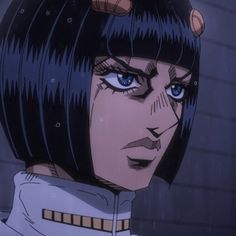 an anime character with blue eyes and short black hair, staring at the camera while standing in front of a brick wall