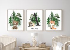 three posters with animals are hanging on the wall above a crib in a nursery