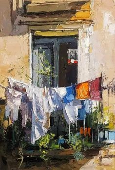 an oil painting of clothes hanging out to dry on a line in front of a building