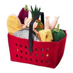 a red basket filled with lots of different items on top of a white background,