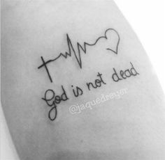 a tattoo with the words god is not dead and a heart on it's arm