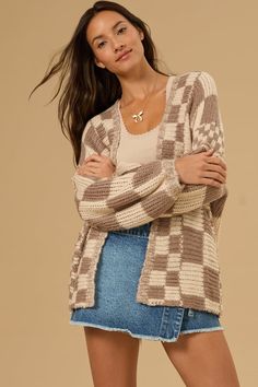 Stay warm and stylish in this cardigan. The oversized fit is perfect for layering over all your favorite outfits on those chillier days. This is an absolute must-have to have in your closet this season. Trendy Knit Sweater Coat, Trendy Long Sleeve Chunky Knit Cardigan, Trendy Chunky Knit Long Sleeve Cardigan, Trendy Open Front Sweater Coat, Trendy Brown Sweater Coat For Layering, Cozy Plaid Sweater, Trendy Oversized Cardigan, Trendy Plaid Sweater For Fall, Casual Oversized Plaid Sweater