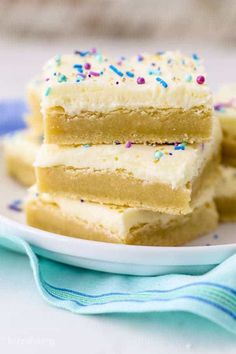 three pieces of cake on a plate with sprinkles