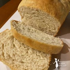 two loaves of bread sitting on top of a white plate