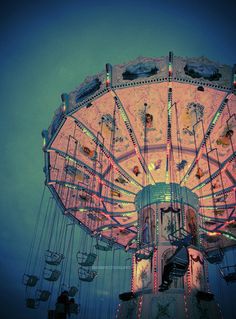 an amusement park ride at night with people on it