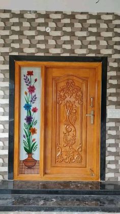 a wooden door with flowers painted on it