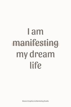 the words i am manifesting my dream life written in grey on a white background