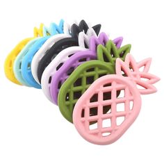 a bunch of different colored hair clips on top of each other