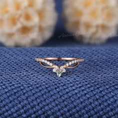 a close up of a ring on a blue cloth